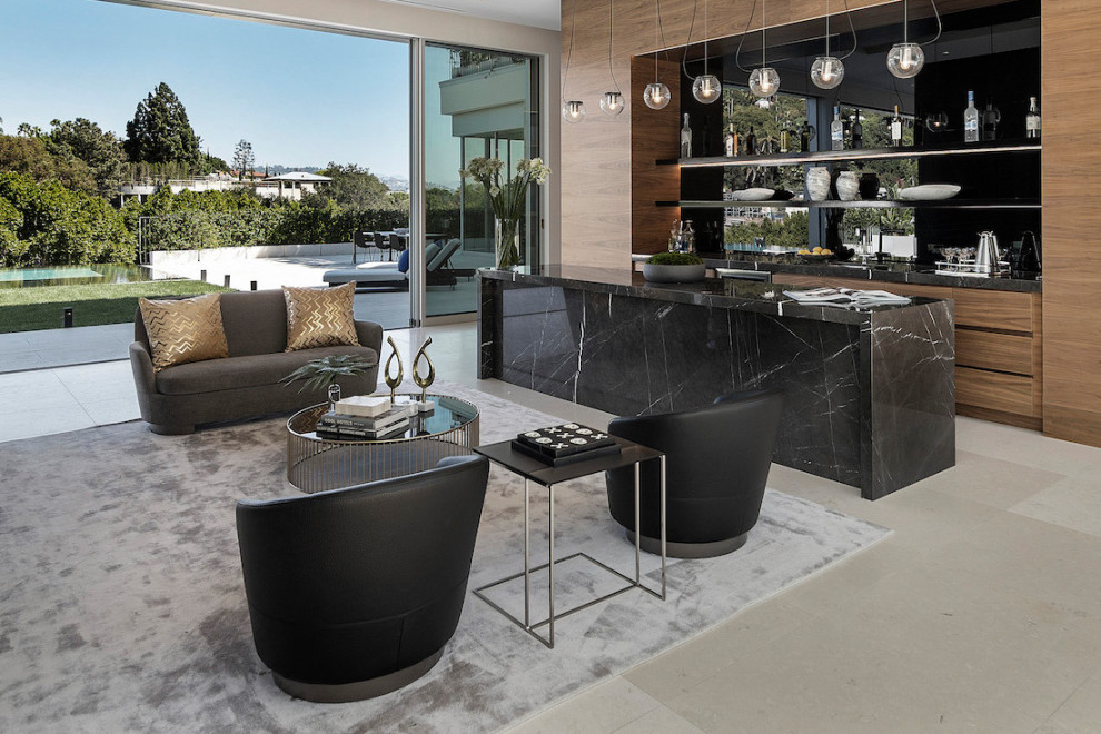 Large contemporary galley seated home bar in Los Angeles with an undermount sink, flat-panel cabinets, light wood cabinets, black splashback, glass tile splashback, beige floor and brown benchtop.