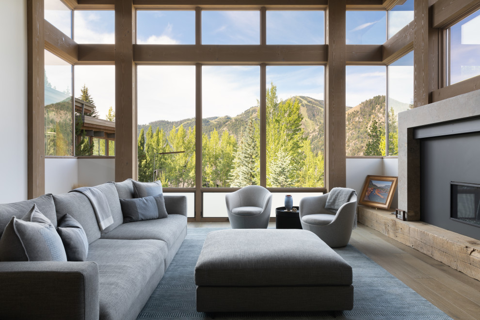 Living room - contemporary open concept light wood floor, beige floor and exposed beam living room idea in San Francisco with white walls, a ribbon fireplace and a metal fireplace