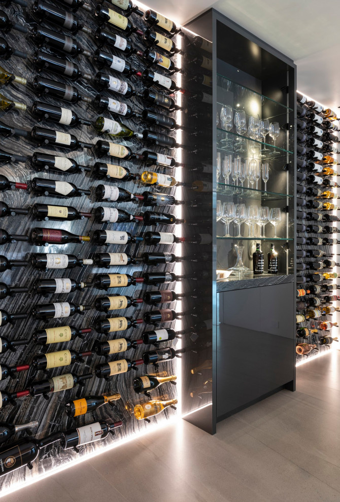 Design ideas for an expansive modern wine cellar in Los Angeles with porcelain floors, storage racks and white floor.