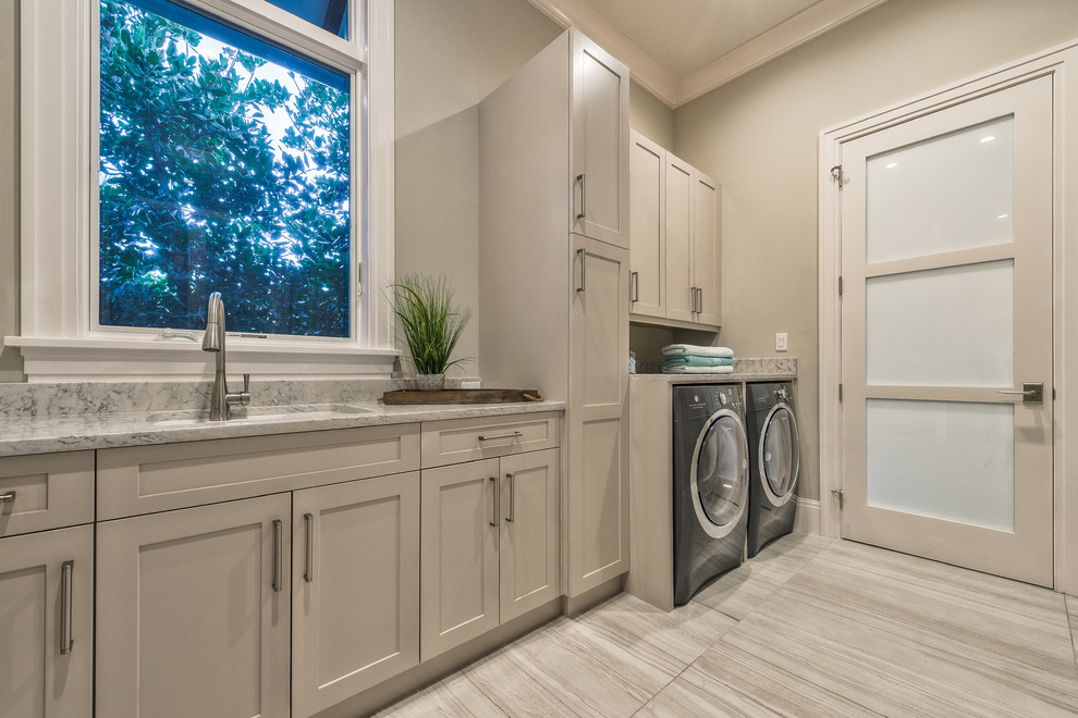 Example of a transitional home design design in Miami