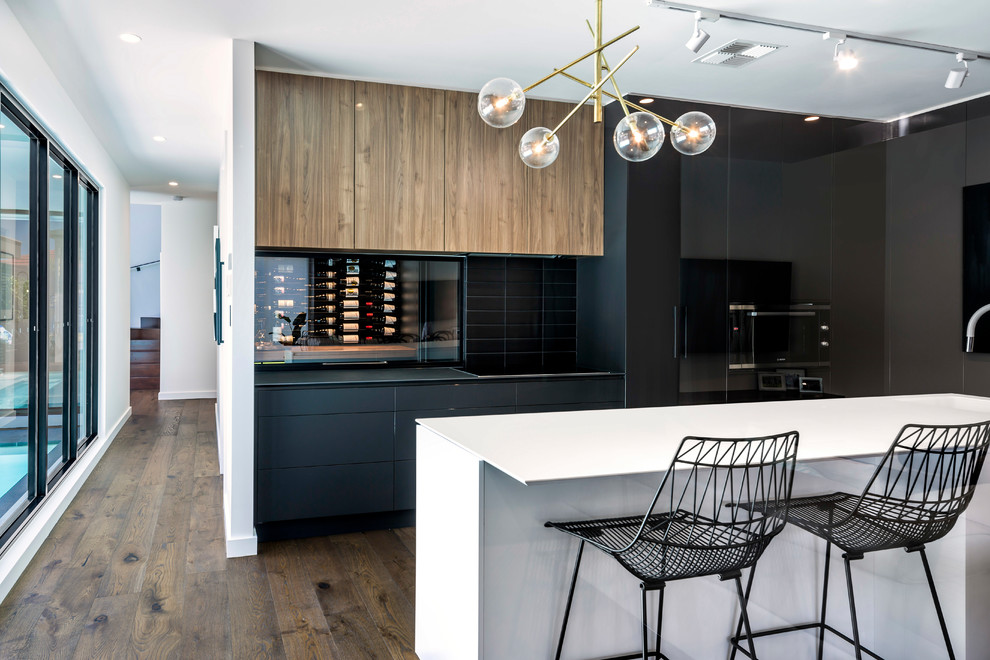 Photo of a contemporary kitchen in Adelaide with black cabinets, black splashback and with island.
