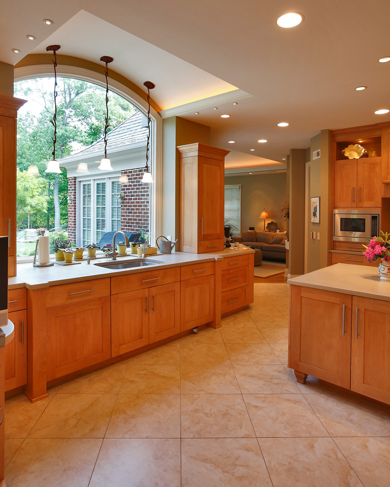 Large transitional galley ceramic tile eat-in kitchen photo in DC Metro with an undermount sink, shaker cabinets, medium tone wood cabinets, stainless steel appliances and an island