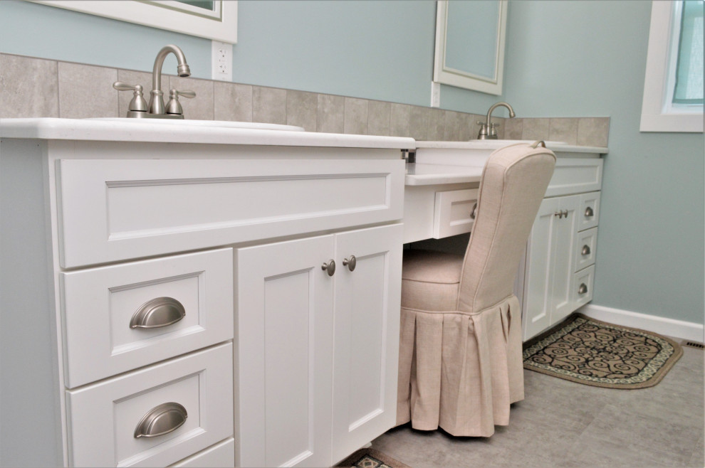 Bathroom - large transitional master single-sink bathroom idea with shaker cabinets, white cabinets, blue walls, a drop-in sink, quartzite countertops, white countertops and a built-in vanity