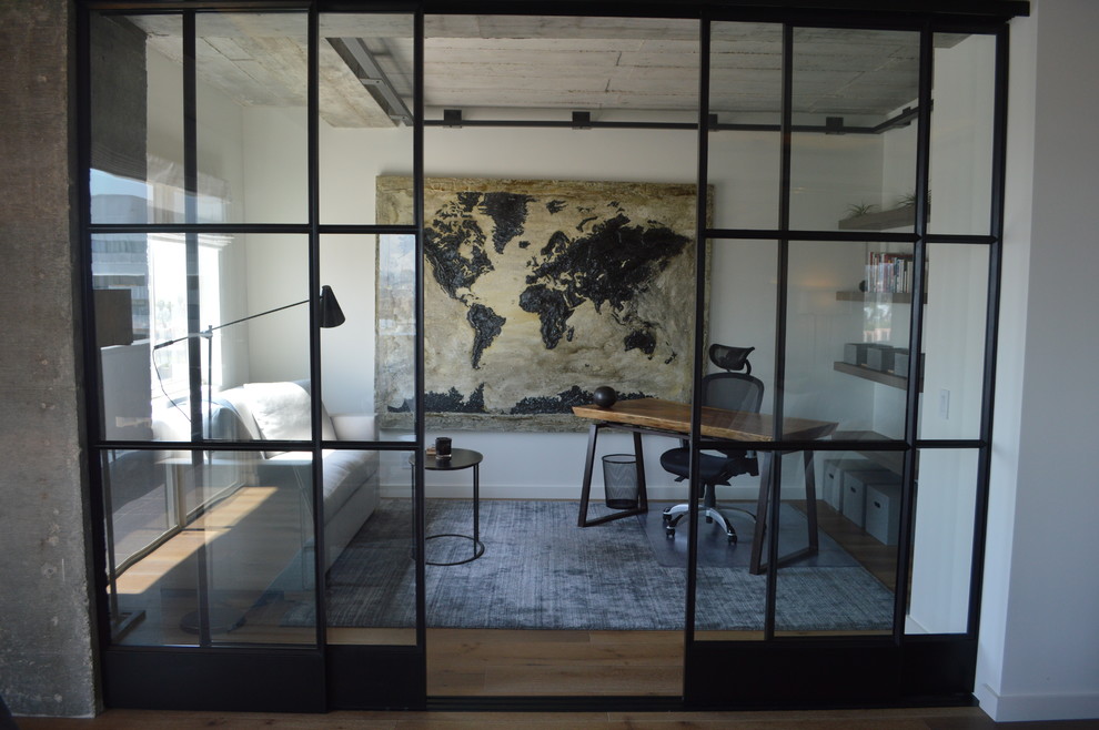 Industrial home office in Los Angeles with white walls.