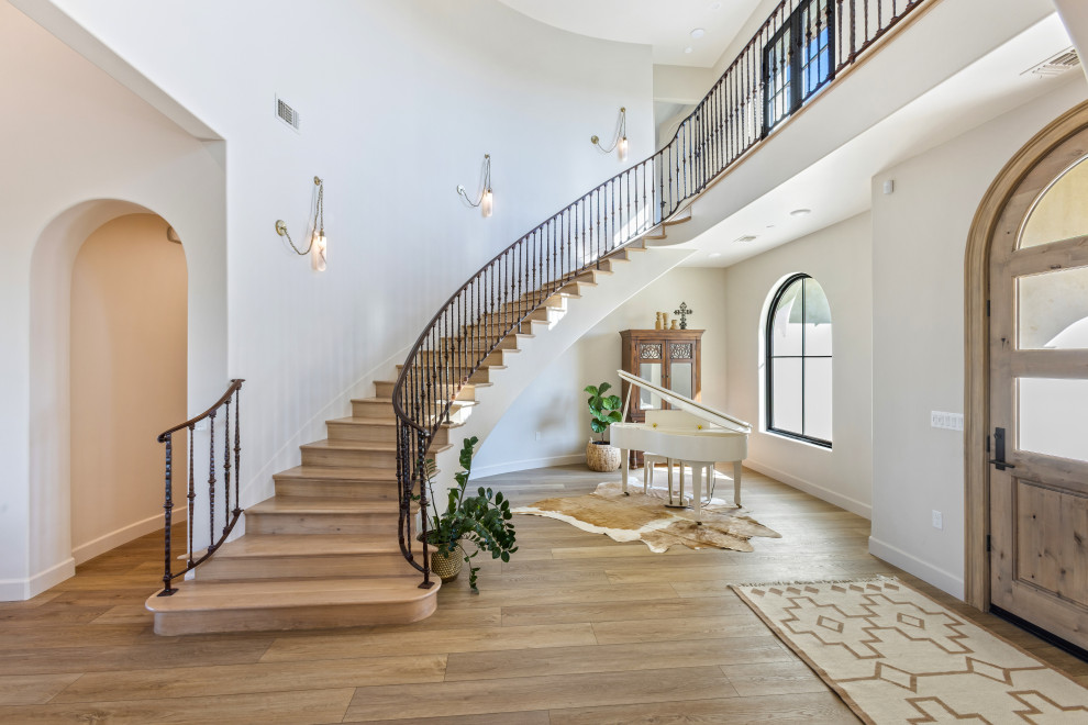 Curved Staircase and Foyer | Tuscan Farmhouse