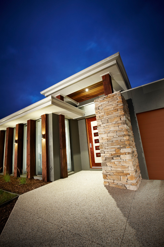 Photo of a mid-sized contemporary one-storey brick grey exterior in Geelong with a hip roof.