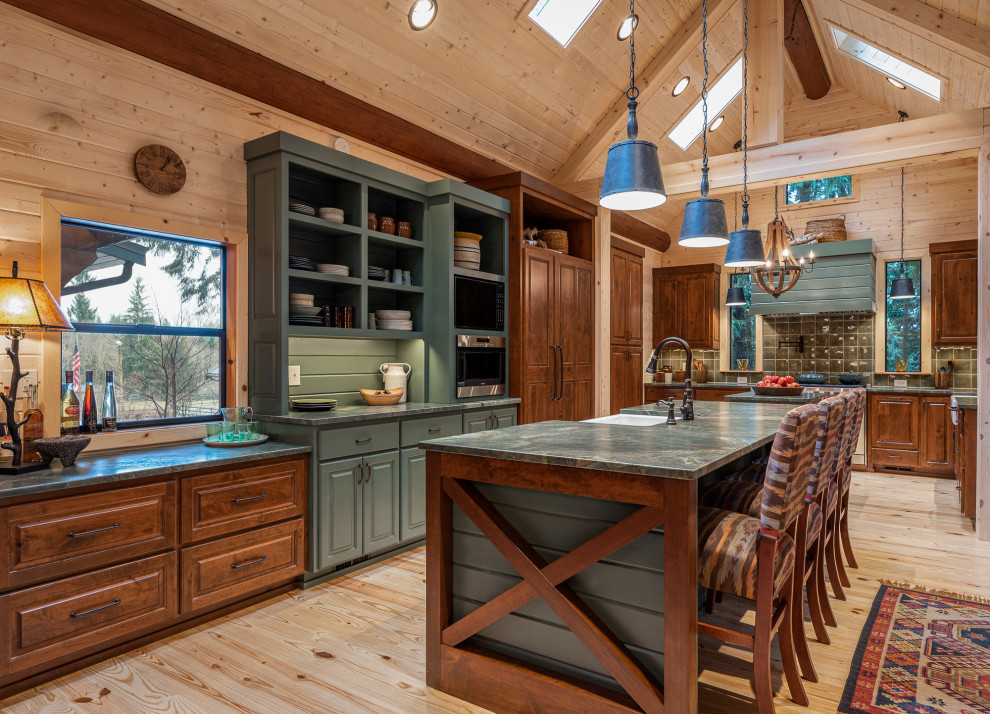 Inspiration for a country l-shaped kitchen in Seattle with panelled appliances, light hardwood floors, exposed beam, vaulted, wood, a farmhouse sink, raised-panel cabinets, dark wood cabinets, green splashback and with island.