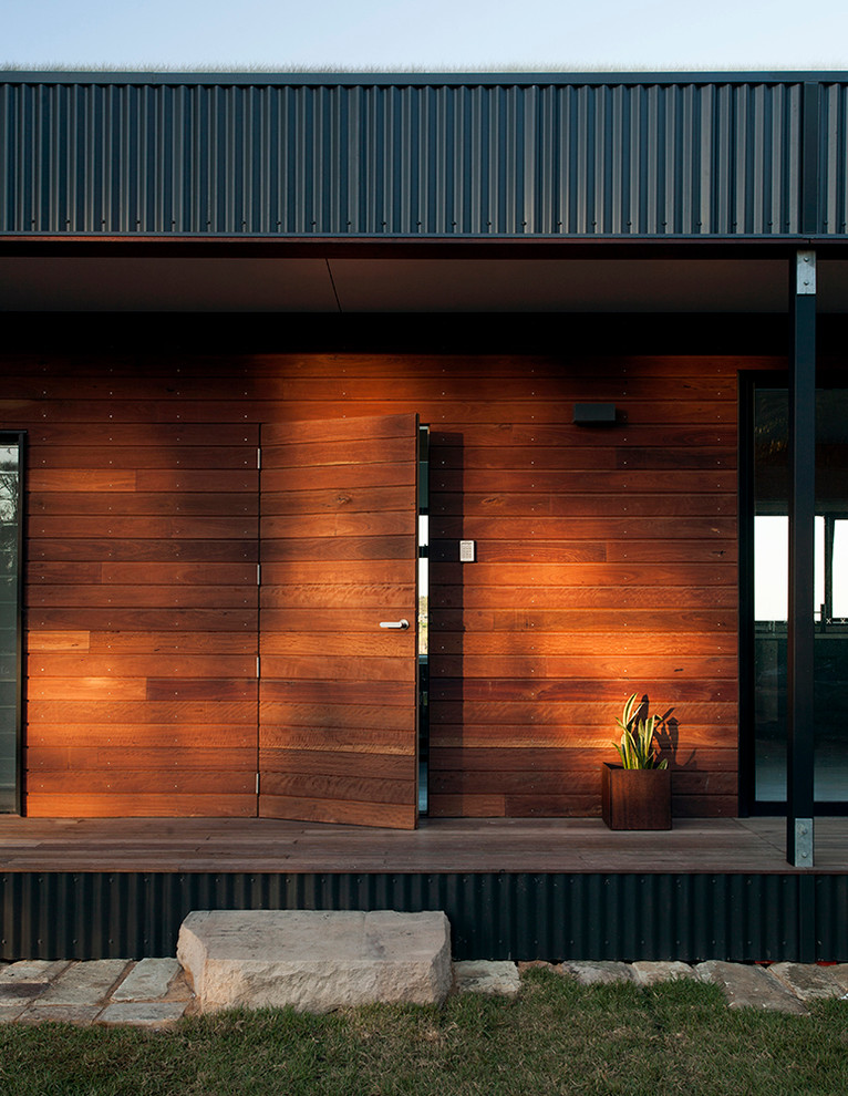 Contemporary exterior in Sydney with wood siding.