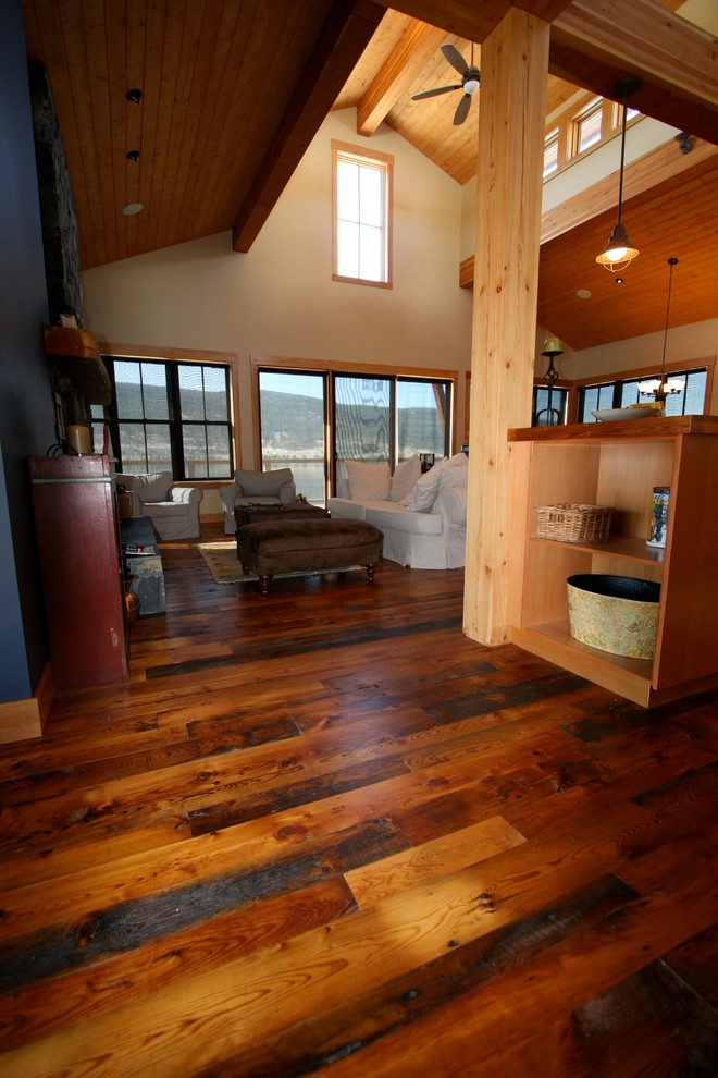 Example of a mid-sized mountain style dark wood floor foyer design in Vancouver with beige walls