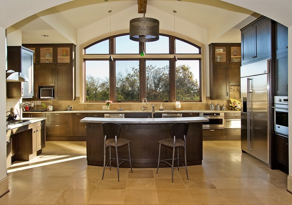 Photo of a contemporary kitchen in Nashville with recessed-panel cabinets, dark wood cabinets and beige splashback.