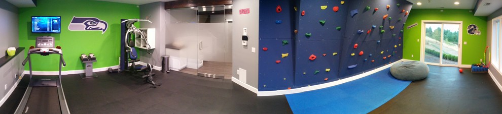 Photo of a mid-sized contemporary multipurpose gym in Portland with multi-coloured walls and black floor.