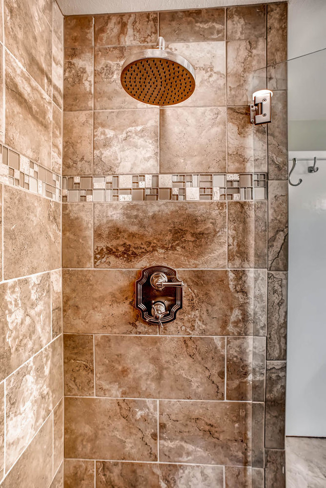 Mid-sized country bathroom in Denver with an undermount sink, shaker cabinets, medium wood cabinets, engineered quartz benchtops, an alcove shower, a two-piece toilet, beige tile, glass tile, beige walls and medium hardwood floors.