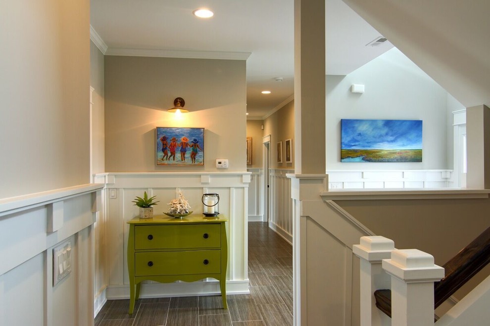 Inspiration for a mid-sized beach style hallway in Other with beige walls and dark hardwood floors.