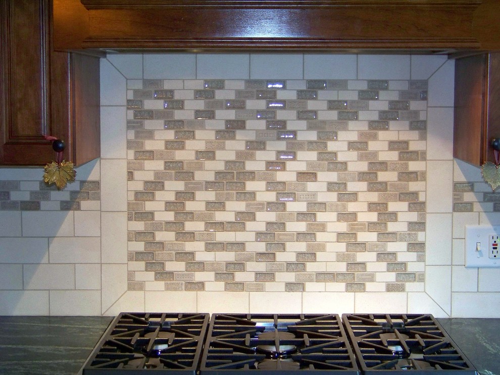 Kitchen - transitional kitchen idea in Chicago with stone slab backsplash