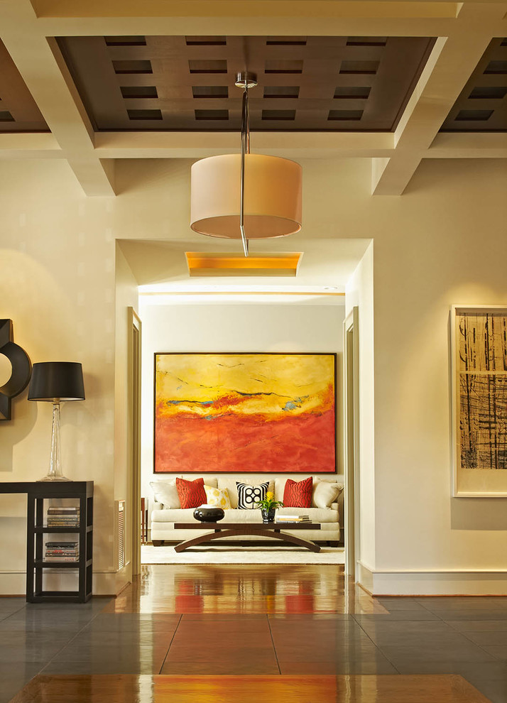 Inspiration for a huge transitional medium tone wood floor foyer remodel in Raleigh with beige walls