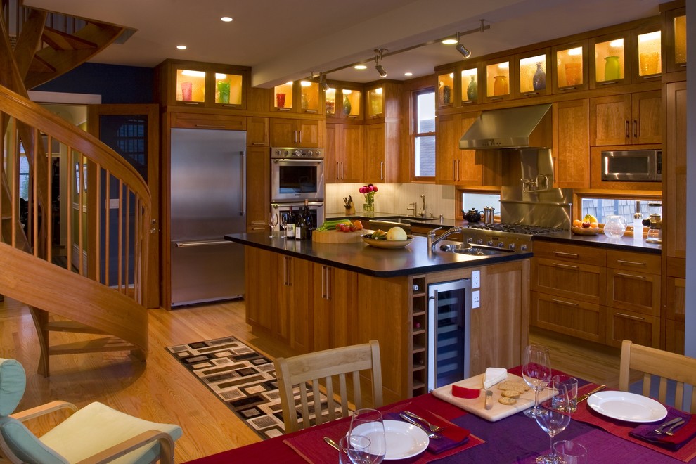 This is an example of a transitional kitchen in San Francisco with shaker cabinets and stainless steel appliances.