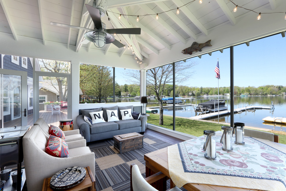 This is an example of a large beach style sunroom in Grand Rapids with dark hardwood floors and a standard ceiling.