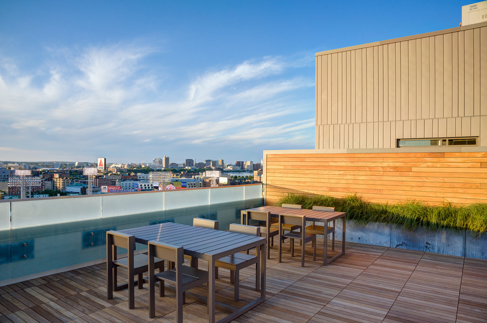 Photo of a large contemporary rooftop deck in Boston with no cover and a container garden.