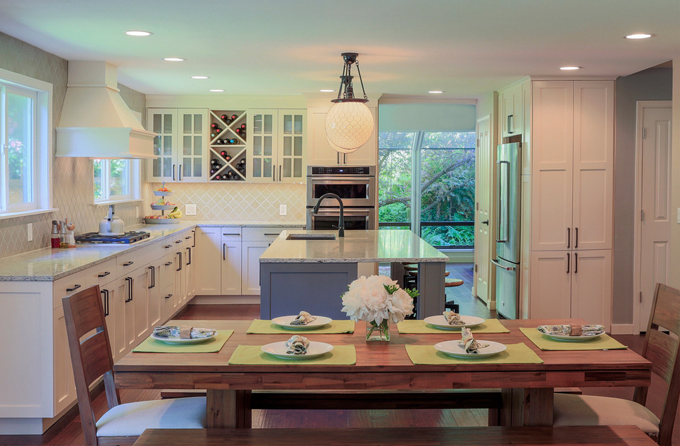 Open concept kitchen - large country u-shaped dark wood floor open concept kitchen idea in Seattle with an undermount sink, shaker cabinets, gray cabinets, quartzite countertops, gray backsplash, mosaic tile backsplash, stainless steel appliances and an island