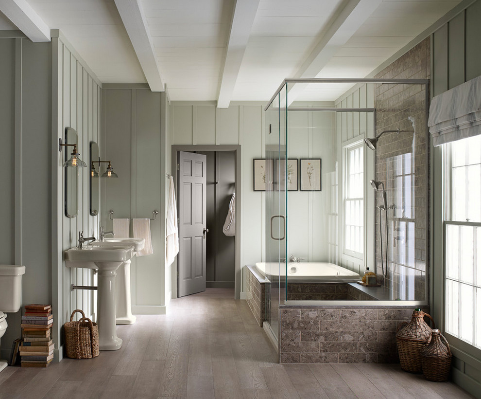 Drop-in bathtub - large transitional master gray tile and stone tile light wood floor and gray floor drop-in bathtub idea in Phoenix with a two-piece toilet, gray walls, a pedestal sink, solid surface countertops and a hinged shower door