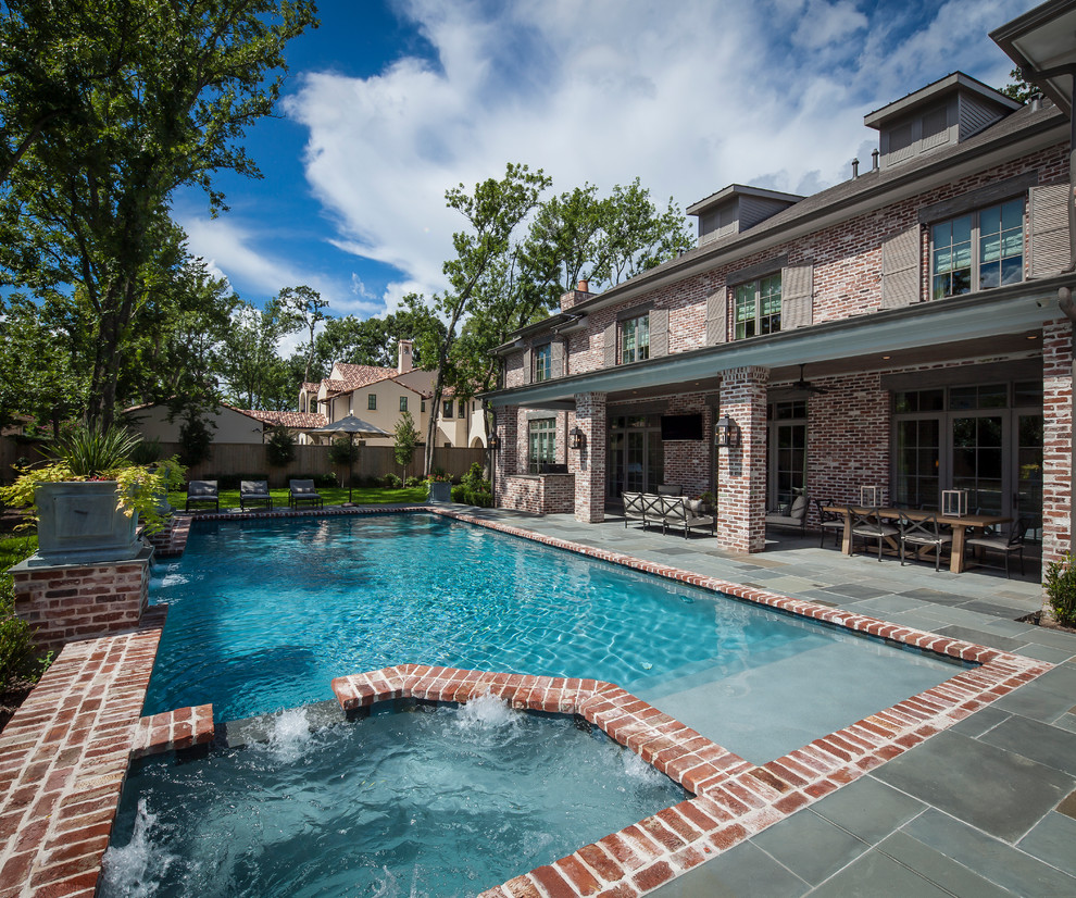 Traditional rectangular pool in Houston with brick pavers.