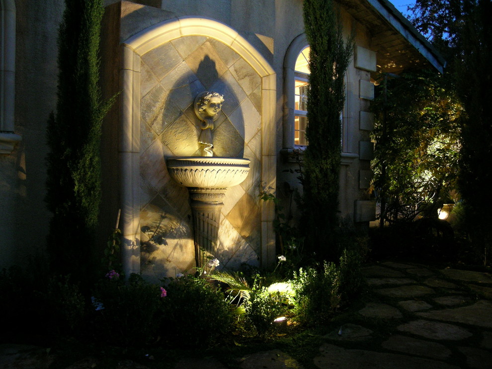 Mid-sized mediterranean side yard garden in San Francisco with a water feature and natural stone pavers.