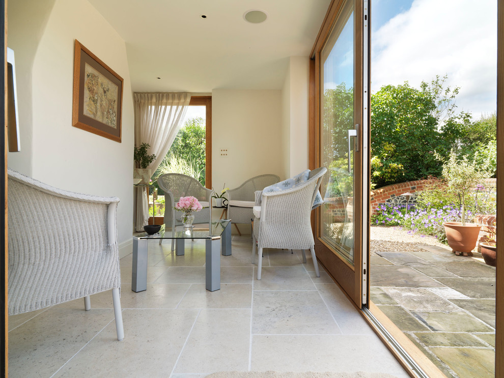 This is an example of a large country sunroom in Hampshire.