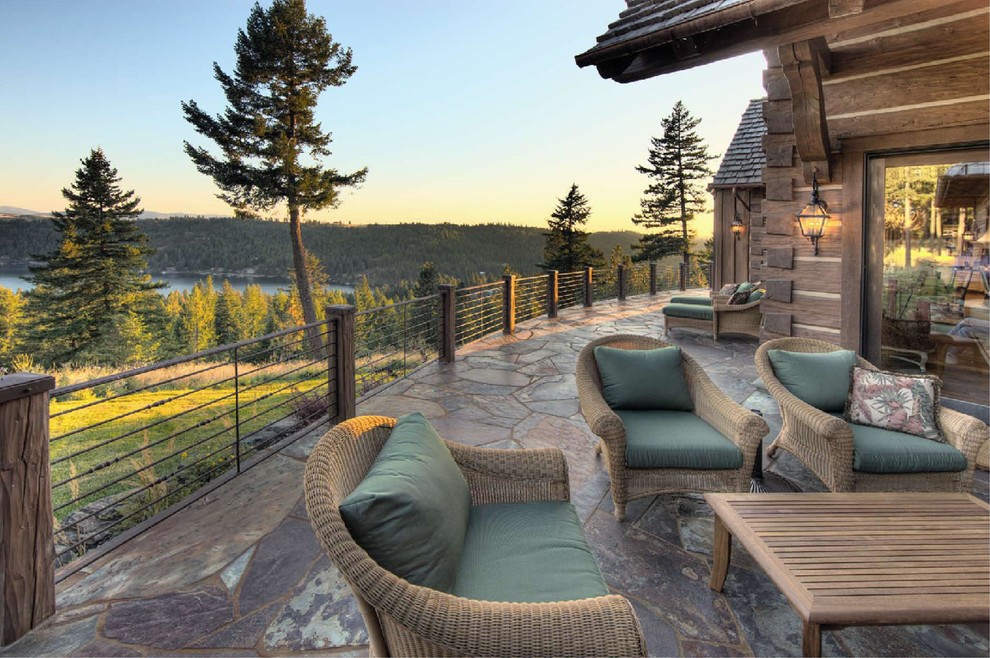 Deck - large rustic backyard deck idea with no cover