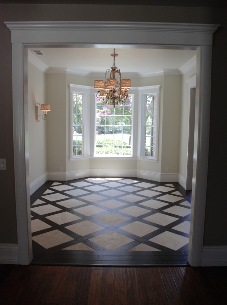 Inspiration for a mid-sized transitional enclosed dining room remodel with beige walls