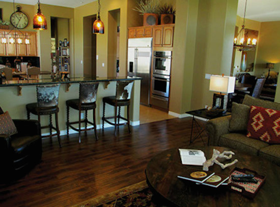 Kitchen - rustic dark wood floor kitchen idea in Phoenix with light wood cabinets, granite countertops, stainless steel appliances and an island