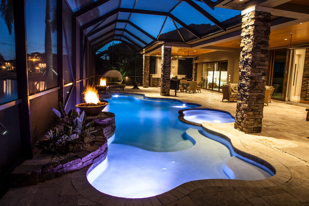 Photo of a mediterranean custom-shaped pool in Orlando.