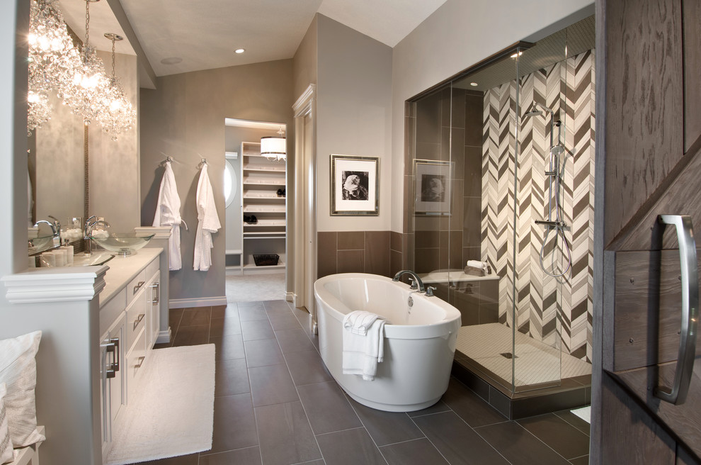 Photo of an expansive contemporary master bathroom in Calgary with flat-panel cabinets, white cabinets, granite benchtops, a freestanding tub, a corner shower, a one-piece toilet, brown tile, ceramic tile, grey walls and ceramic floors.