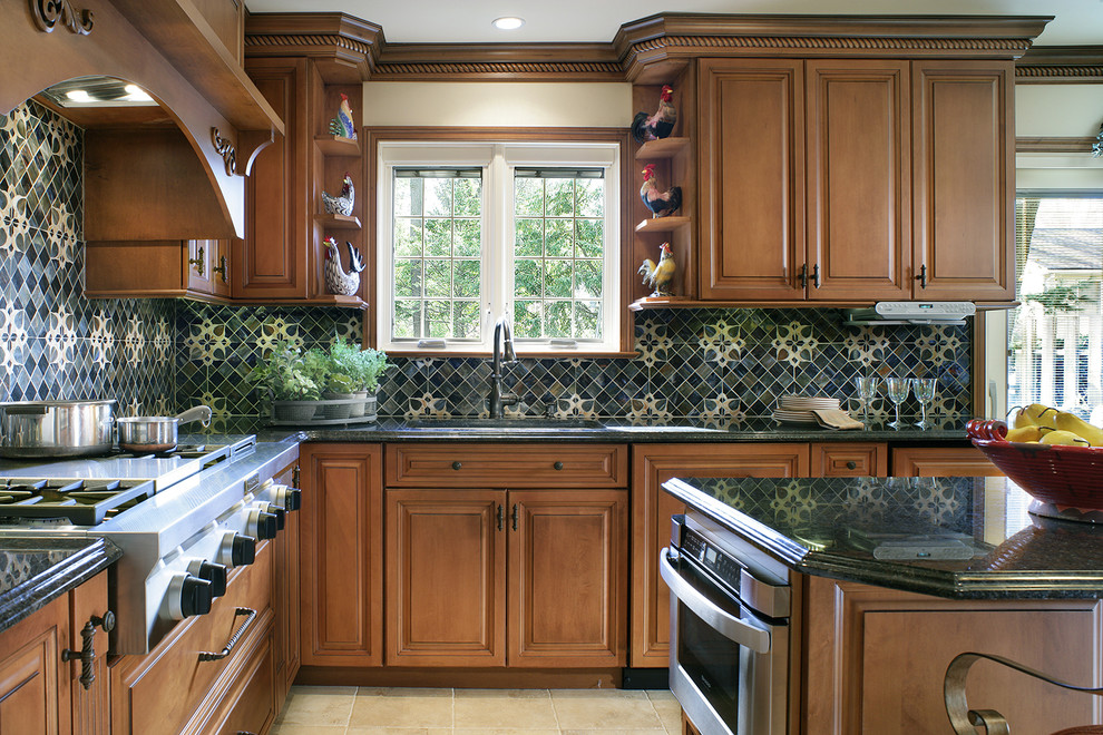 Inspiration for a large traditional eat-in kitchen in New York with raised-panel cabinets, medium wood cabinets, glass tile splashback, panelled appliances, an undermount sink, granite benchtops and blue splashback.