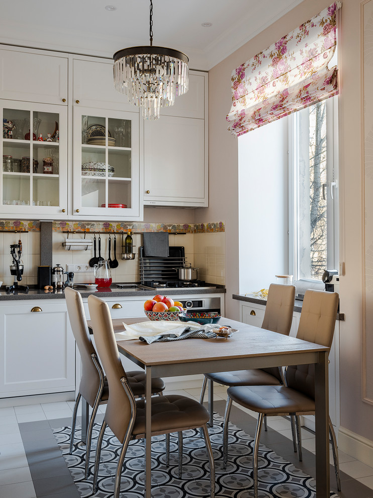 Inspiration for a small traditional single-wall eat-in kitchen in Moscow with glass-front cabinets, white cabinets, quartz benchtops, beige splashback, ceramic splashback, stainless steel appliances, ceramic floors, grey benchtop, no island and multi-coloured floor.