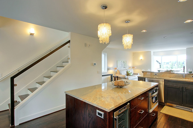 Eat-in kitchen - transitional eat-in kitchen idea in Seattle with an undermount sink, granite countertops and stainless steel appliances