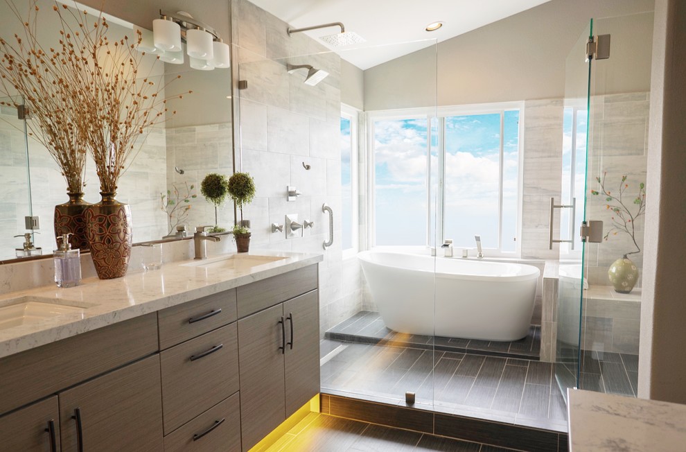 This is an example of a mid-sized modern master bathroom in Orange County with flat-panel cabinets, beige cabinets, a freestanding tub, a shower/bathtub combo, a one-piece toilet, porcelain tile, porcelain floors, a drop-in sink, engineered quartz benchtops, black floor, a hinged shower door and beige walls.