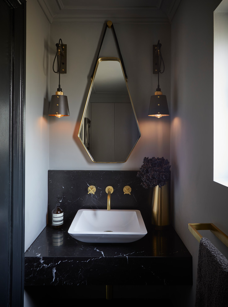 Inspiration for a small contemporary powder room in Hertfordshire with grey walls, a vessel sink, marble benchtops, black benchtops, black tile and marble.