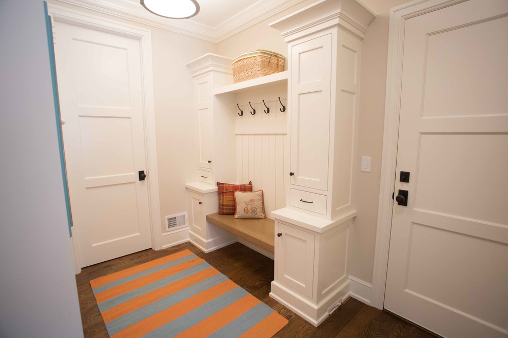 Mid-sized transitional dark wood floor mudroom photo in San Diego with beige walls and a white front door