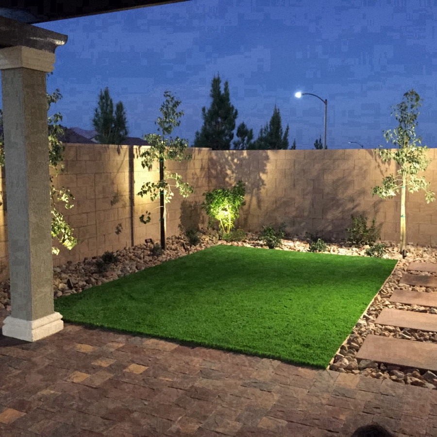 Design ideas for a mid-sized traditional backyard full sun garden in Las Vegas with brick pavers.