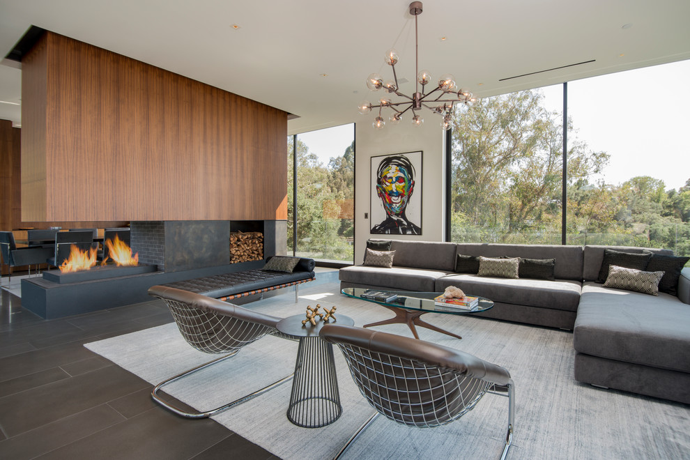 Inspiration for a midcentury open concept living room in Other with white walls, a ribbon fireplace and grey floor.