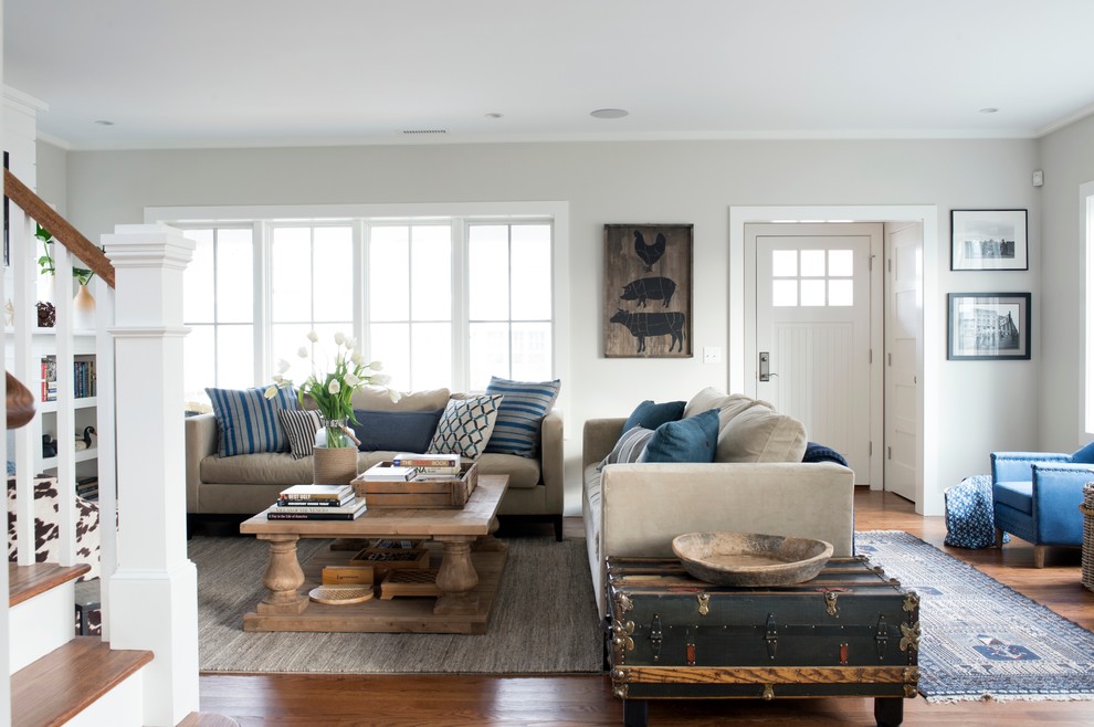 This is an example of a mid-sized beach style formal enclosed living room in New York with grey walls, dark hardwood floors, a ribbon fireplace, a concrete fireplace surround, a wall-mounted tv and brown floor.