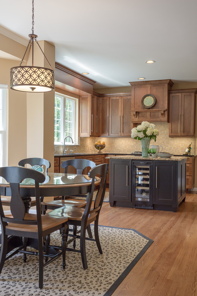 Example of a mid-sized transitional l-shaped medium tone wood floor eat-in kitchen design in DC Metro with an undermount sink, recessed-panel cabinets, medium tone wood cabinets, quartz countertops, stone tile backsplash, paneled appliances and an island