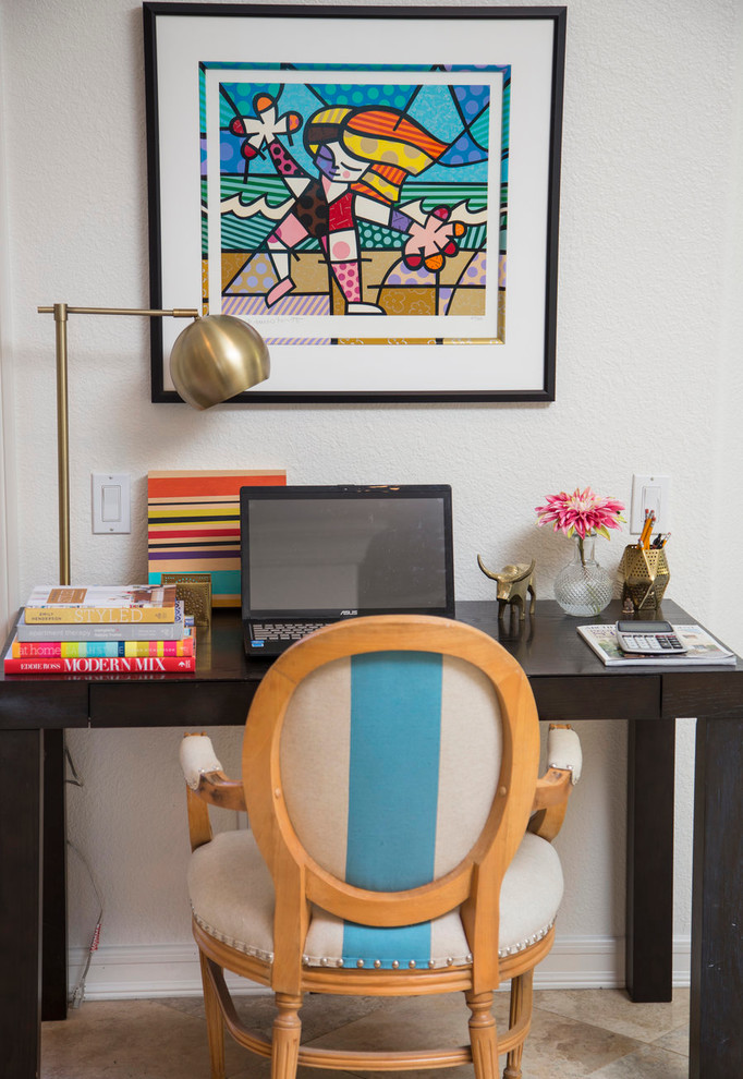 Inspiration for a small eclectic study room in San Diego with white walls, travertine floors and a freestanding desk.