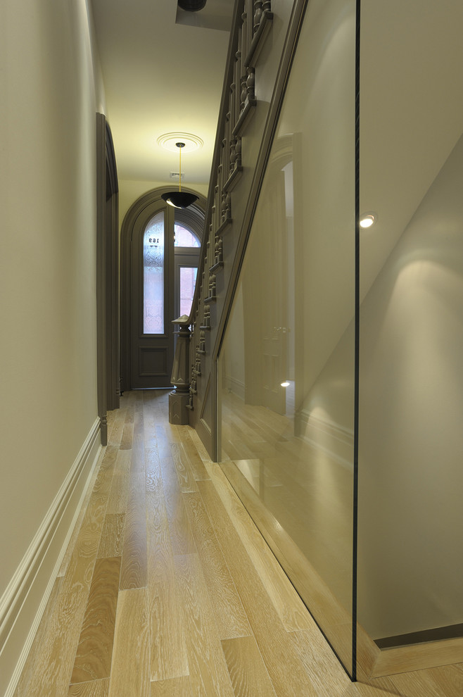 This is an example of a traditional entry hall in New York with beige walls.