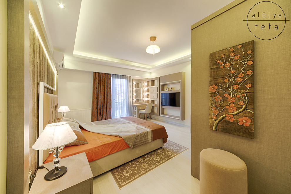 Mid-sized modern bedroom in Other with beige walls, light hardwood floors and beige floor.