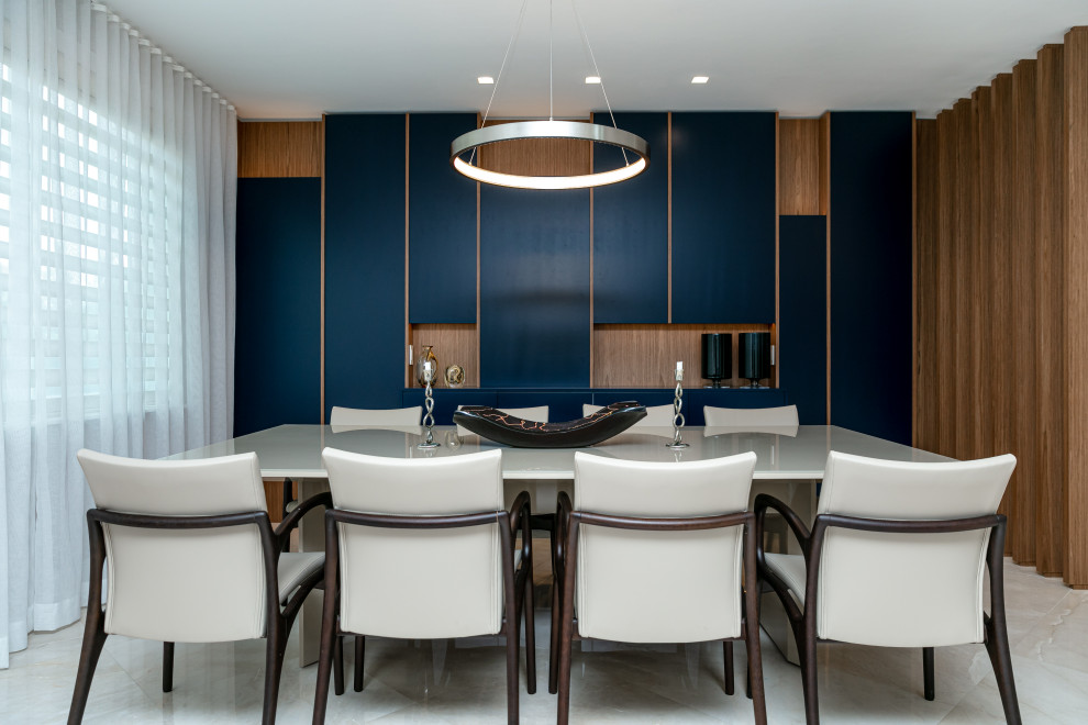 Contemporary dining room in Miami with multi-coloured walls, no fireplace, beige floor and wood walls.