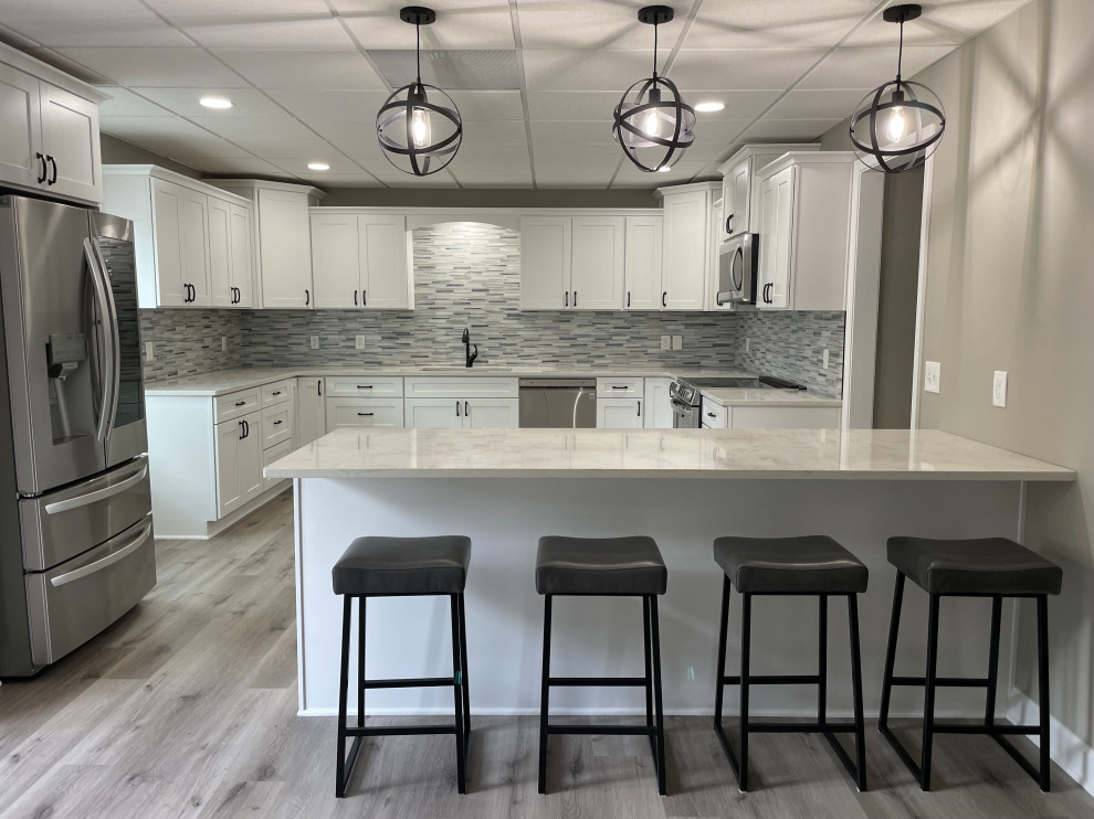 Inspiration for a transitional kitchen remodel with a double-bowl sink