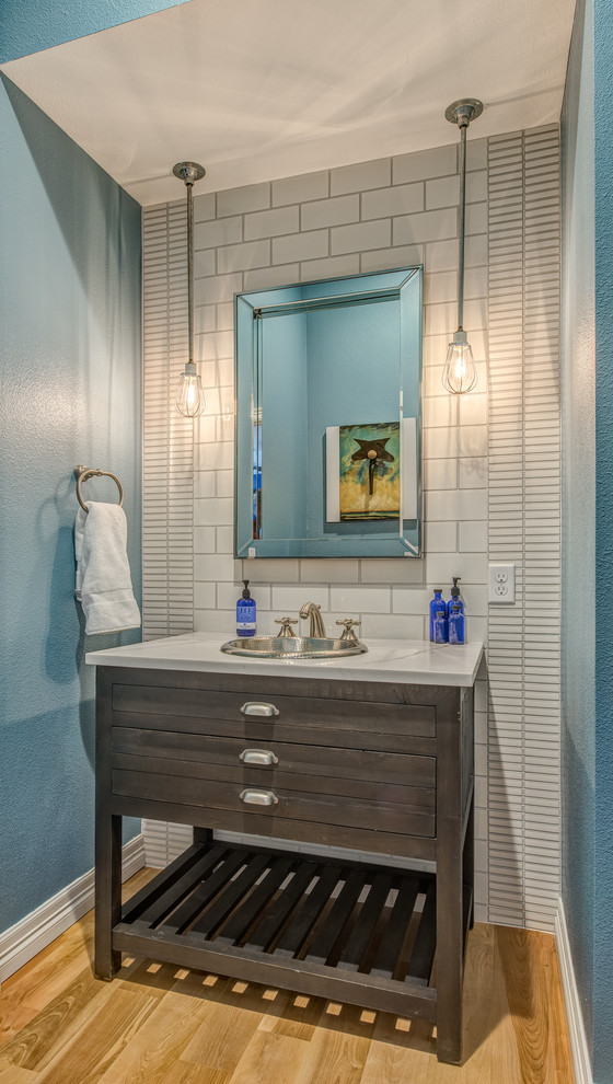 Eat-in kitchen - large transitional u-shaped light wood floor eat-in kitchen idea in Denver with a farmhouse sink, recessed-panel cabinets, gray cabinets, quartzite countertops, blue backsplash, ceramic backsplash, stainless steel appliances and an island