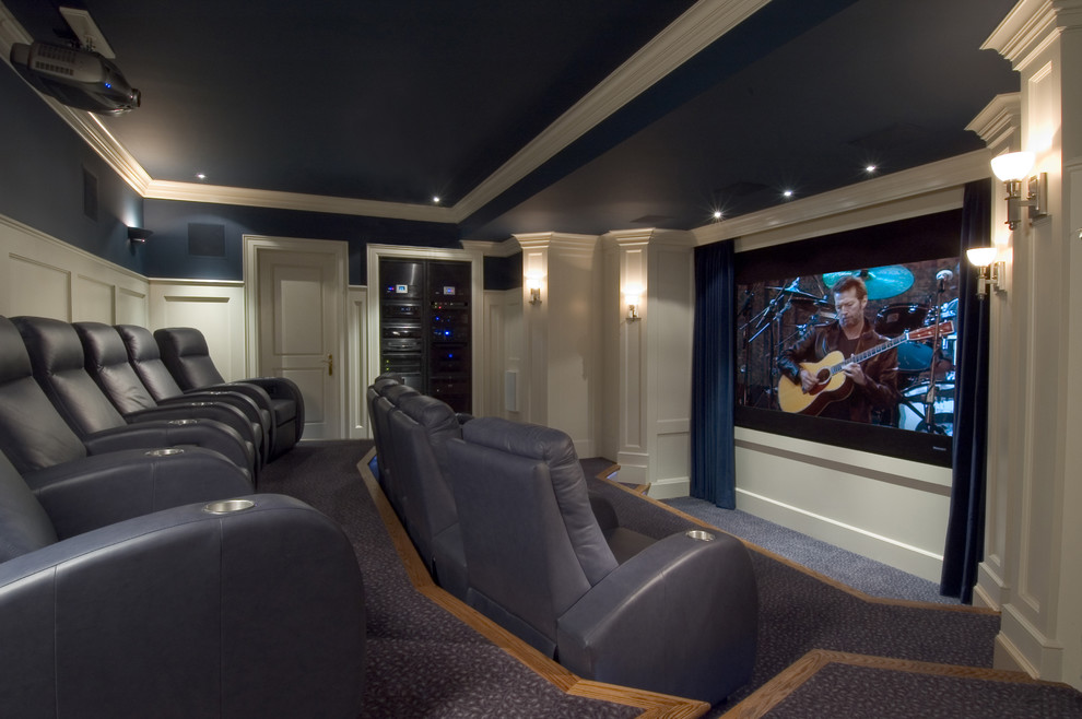 This is an example of a traditional home theatre in Toronto with blue walls and blue floor.