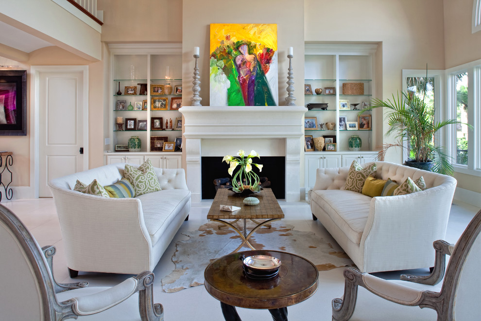 Inspiration for a traditional living room in Charleston with beige walls and a standard fireplace.